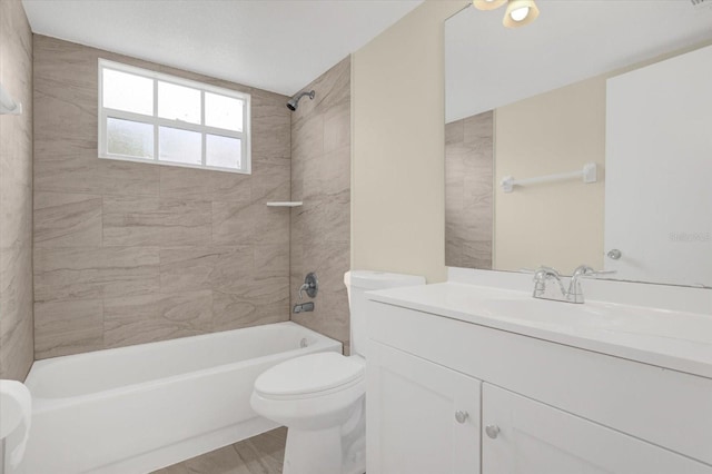 bathroom with vanity, toilet, and shower / bath combination