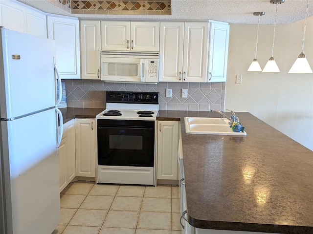 kitchen with hanging light fixtures, backsplash, light tile patterned flooring, white cabinetry, and white appliances