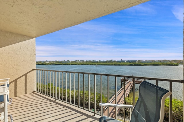 balcony featuring a water view