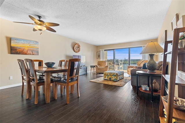 dining area featuring dark hardwood / wood-style floors, a textured ceiling, and ceiling fan