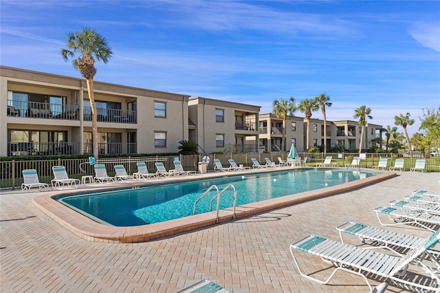 view of swimming pool featuring a patio area