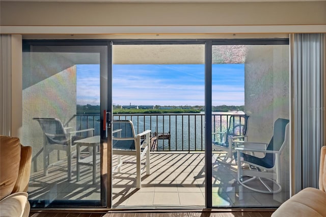 balcony featuring a water view