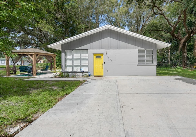 exterior space featuring a gazebo and a lawn