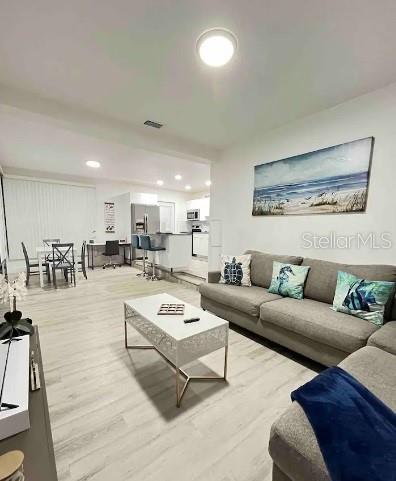 living room with light wood-type flooring