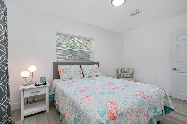 bedroom featuring hardwood / wood-style flooring