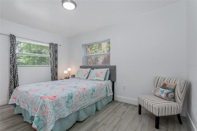 bedroom with hardwood / wood-style floors