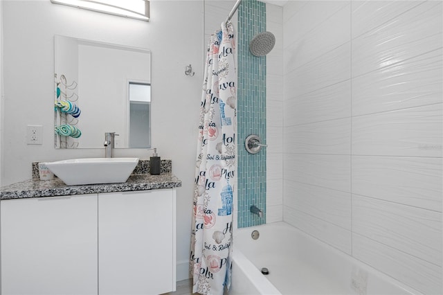 bathroom featuring vanity and shower / bath combo