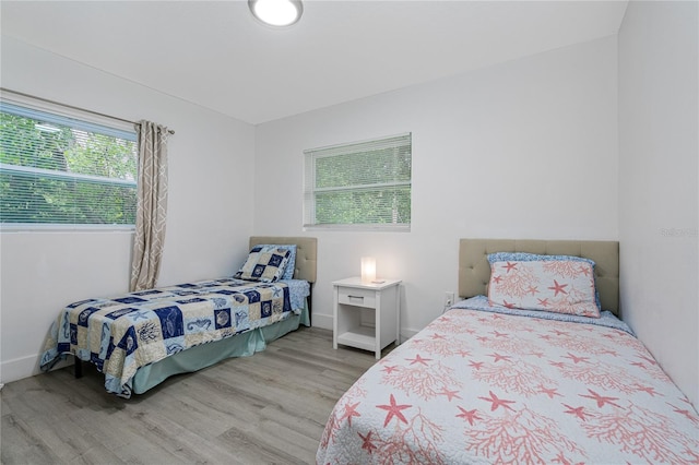 bedroom with light hardwood / wood-style flooring