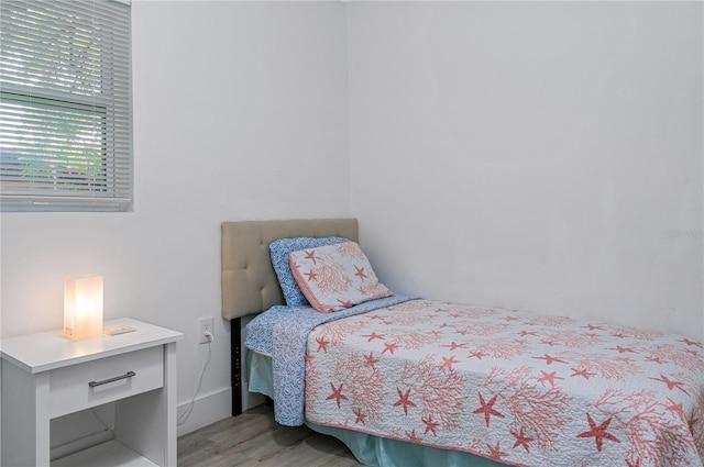 bedroom with light hardwood / wood-style floors