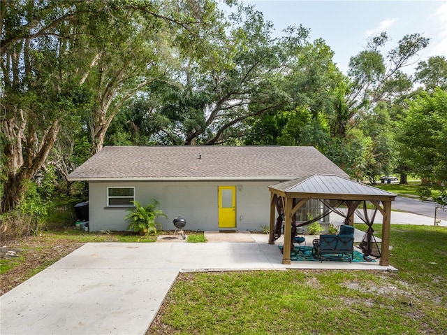 exterior space with a gazebo and a yard