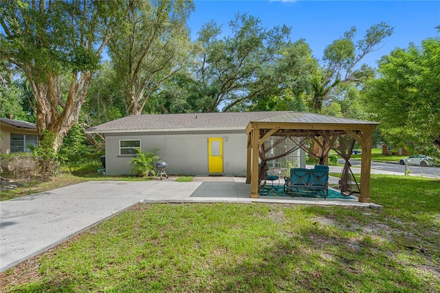 view of parking featuring a gazebo and a yard