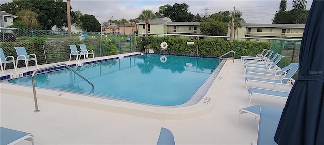 view of swimming pool featuring a patio area