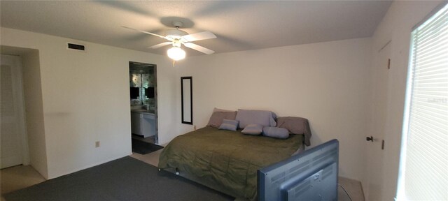 bedroom featuring connected bathroom and ceiling fan