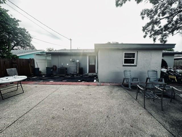 back of house with a patio area and central air condition unit