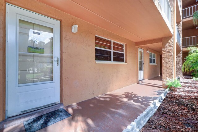 doorway to property with a balcony