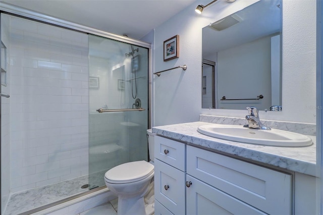 bathroom with walk in shower, toilet, and vanity