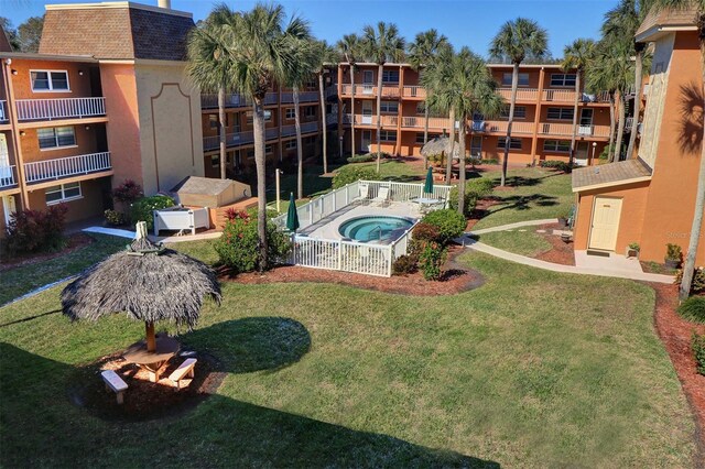 view of pool with a yard