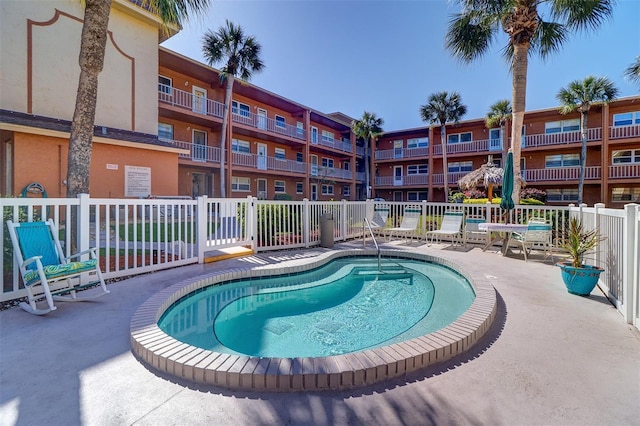 view of swimming pool featuring a pool and fence