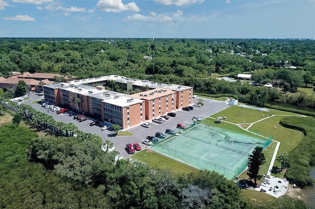 drone / aerial view with a wooded view