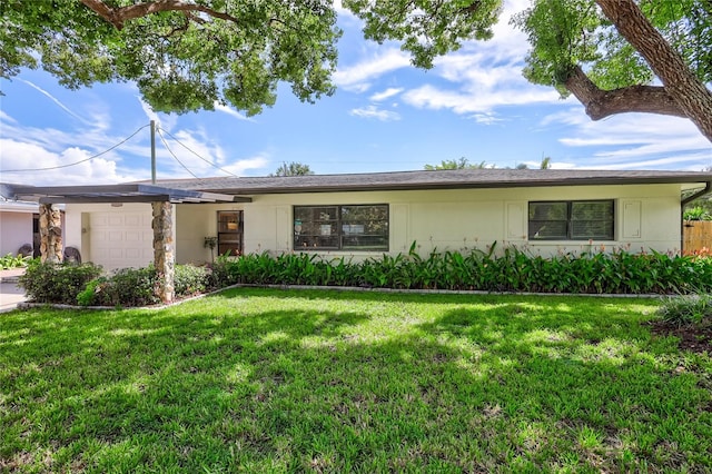 ranch-style house with a garage and a front yard