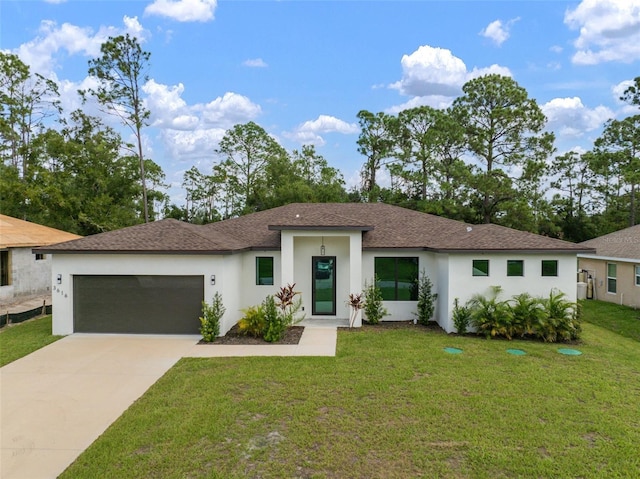 view of front of house featuring a front yard, a shingled roof, stucco siding, concrete driveway, and a garage