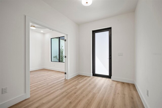 interior space with ceiling fan and light hardwood / wood-style floors