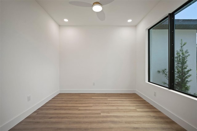 spare room with ceiling fan and light hardwood / wood-style floors