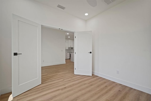 unfurnished room featuring light wood-type flooring