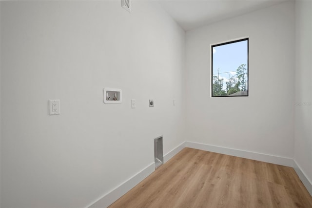 laundry area featuring washer hookup, hookup for an electric dryer, and light hardwood / wood-style flooring