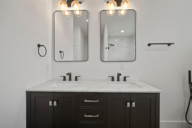 bathroom featuring a shower and vanity