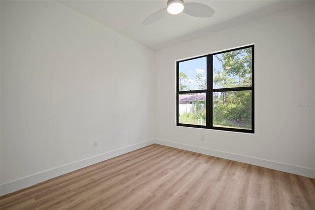 unfurnished room featuring ceiling fan and light hardwood / wood-style floors