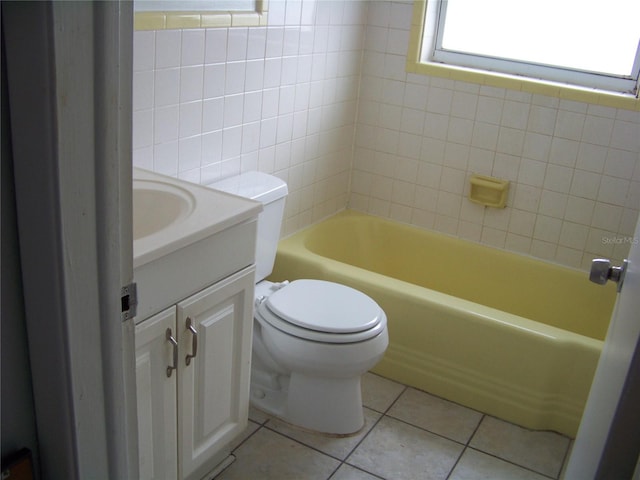 bathroom with vanity, toilet, and tile patterned floors