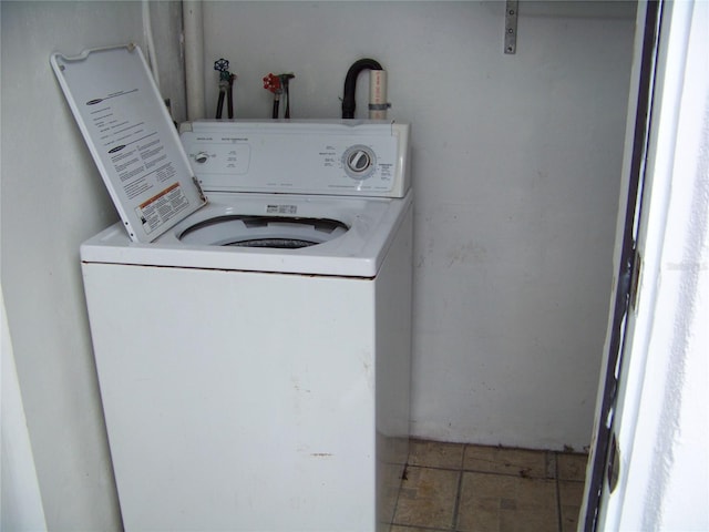 washroom with washer / dryer