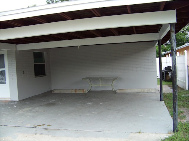 view of patio / terrace with area for grilling and a carport