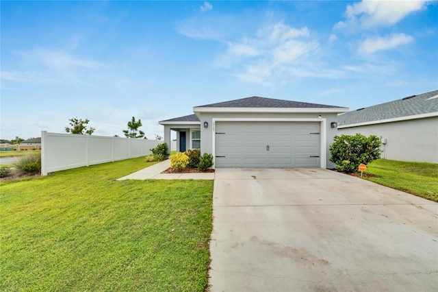 view of front facade featuring a front yard and a garage