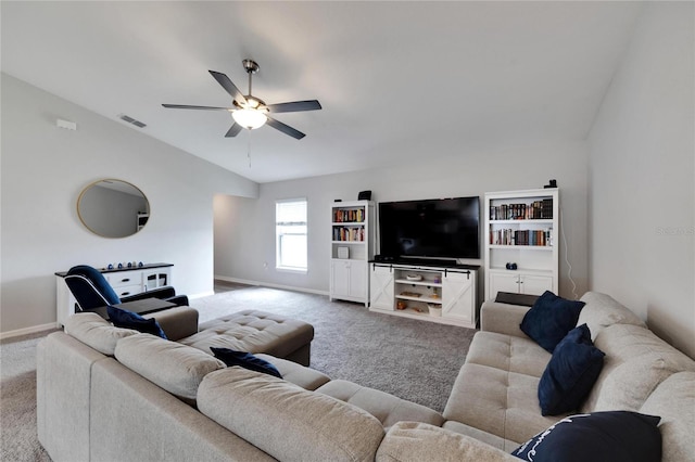 carpeted living room with ceiling fan