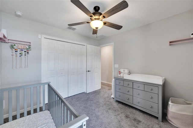 carpeted bedroom with a closet and ceiling fan