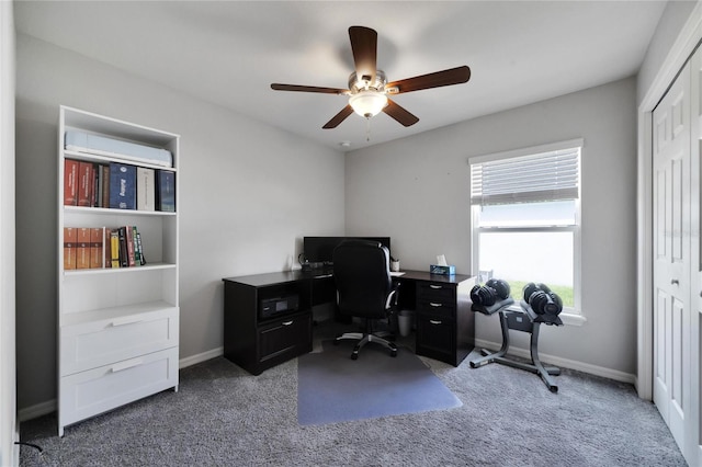 carpeted home office with ceiling fan