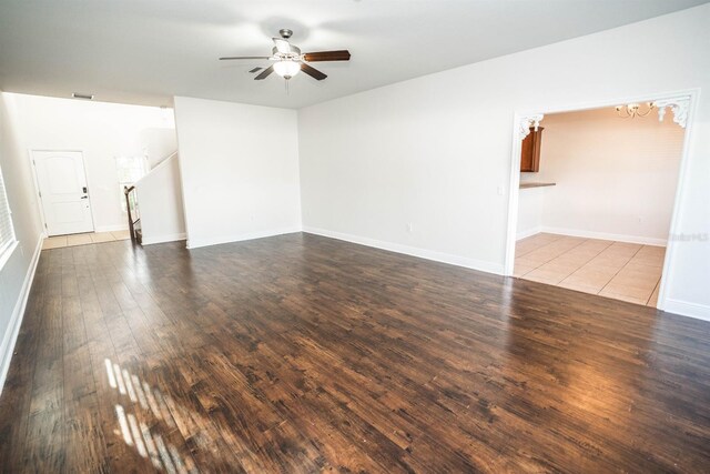 spare room with light wood-type flooring and ceiling fan