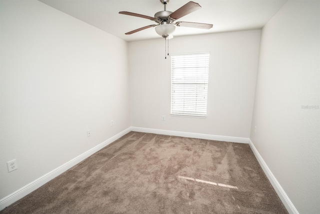 unfurnished room with ceiling fan and light carpet