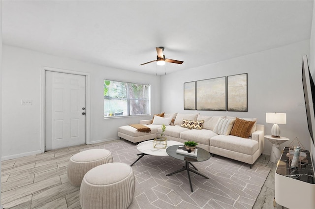 living room featuring light wood-type flooring and ceiling fan