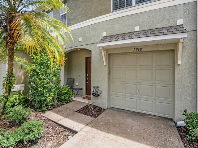 property entrance featuring a garage