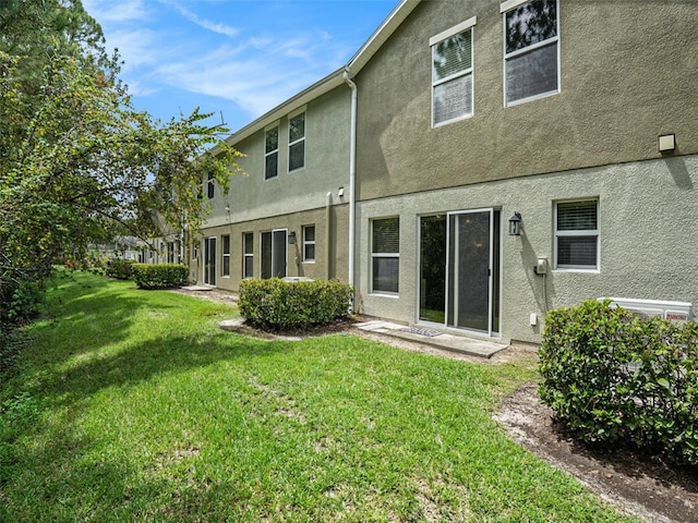 back of house with a yard