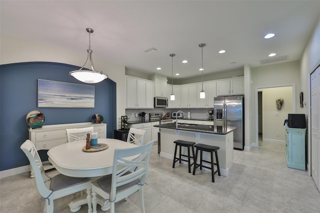 tiled dining area with sink