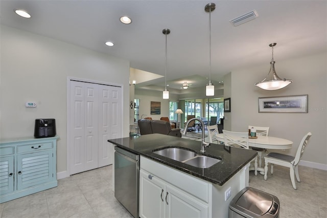 kitchen featuring white cabinetry, dishwasher, sink, hanging light fixtures, and an island with sink