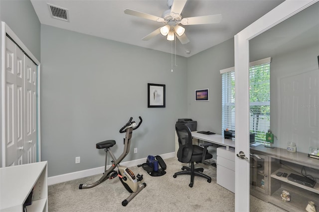 office area with ceiling fan and light carpet