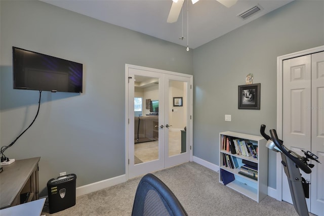 carpeted office featuring ceiling fan and french doors