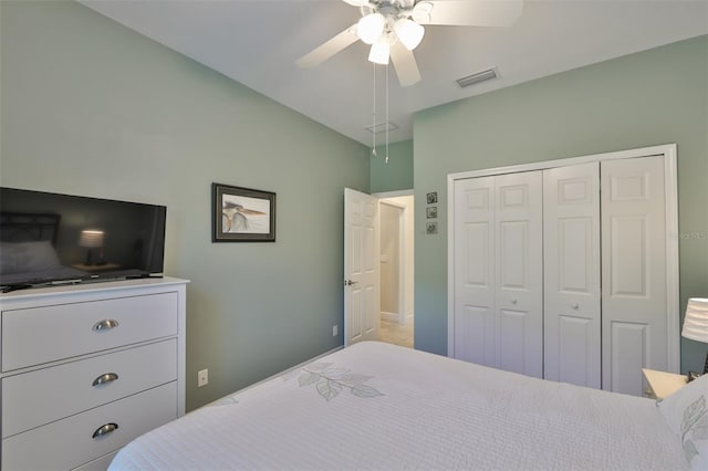 bedroom with ceiling fan and a closet