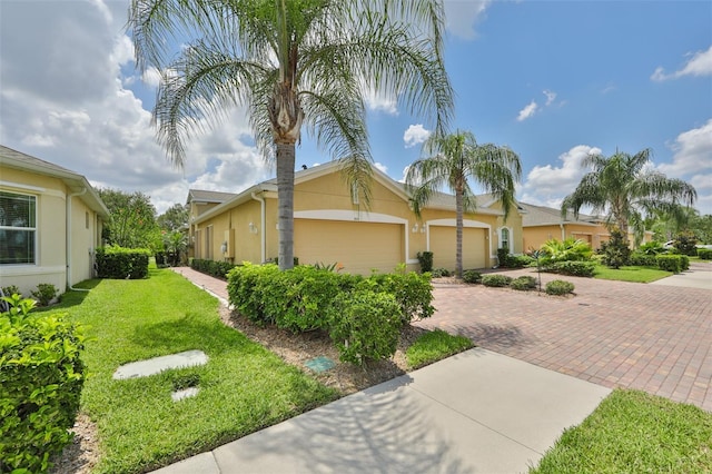 view of side of property with a garage and a lawn