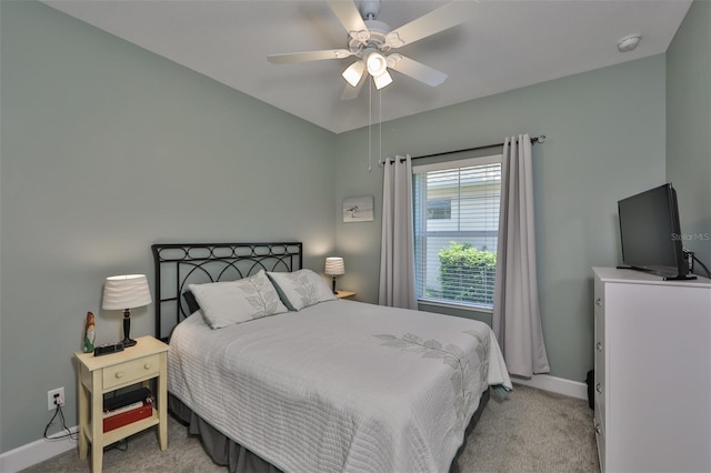 bedroom with ceiling fan and light colored carpet